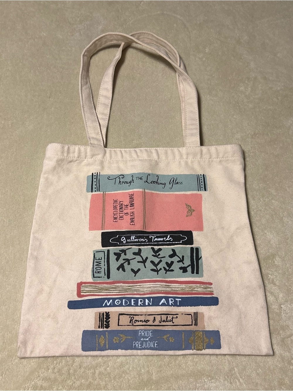 kate spade Cream Canvas Tote with Colorful Book-Stack Print